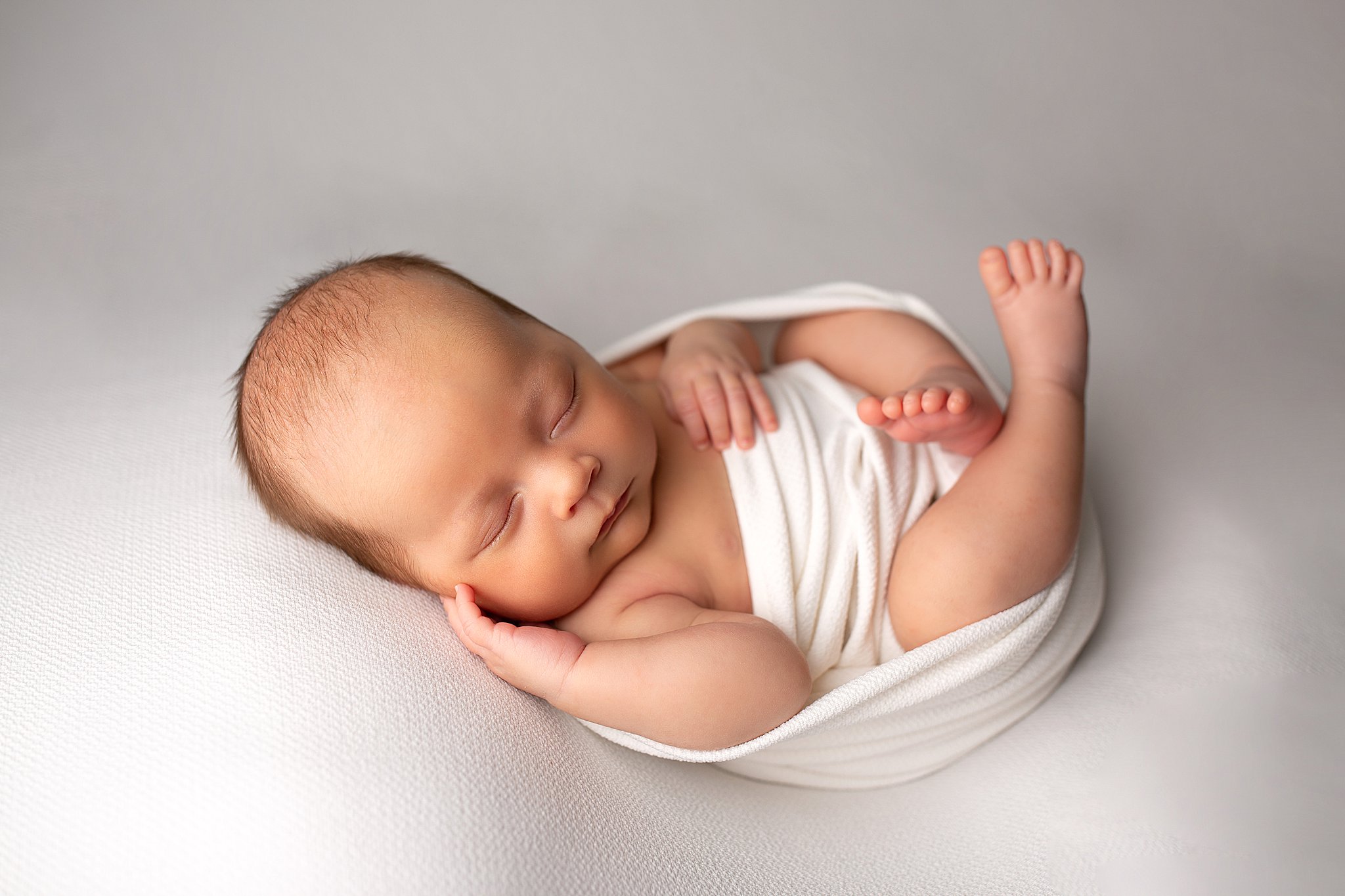 Baby boy neutral white newborn photography