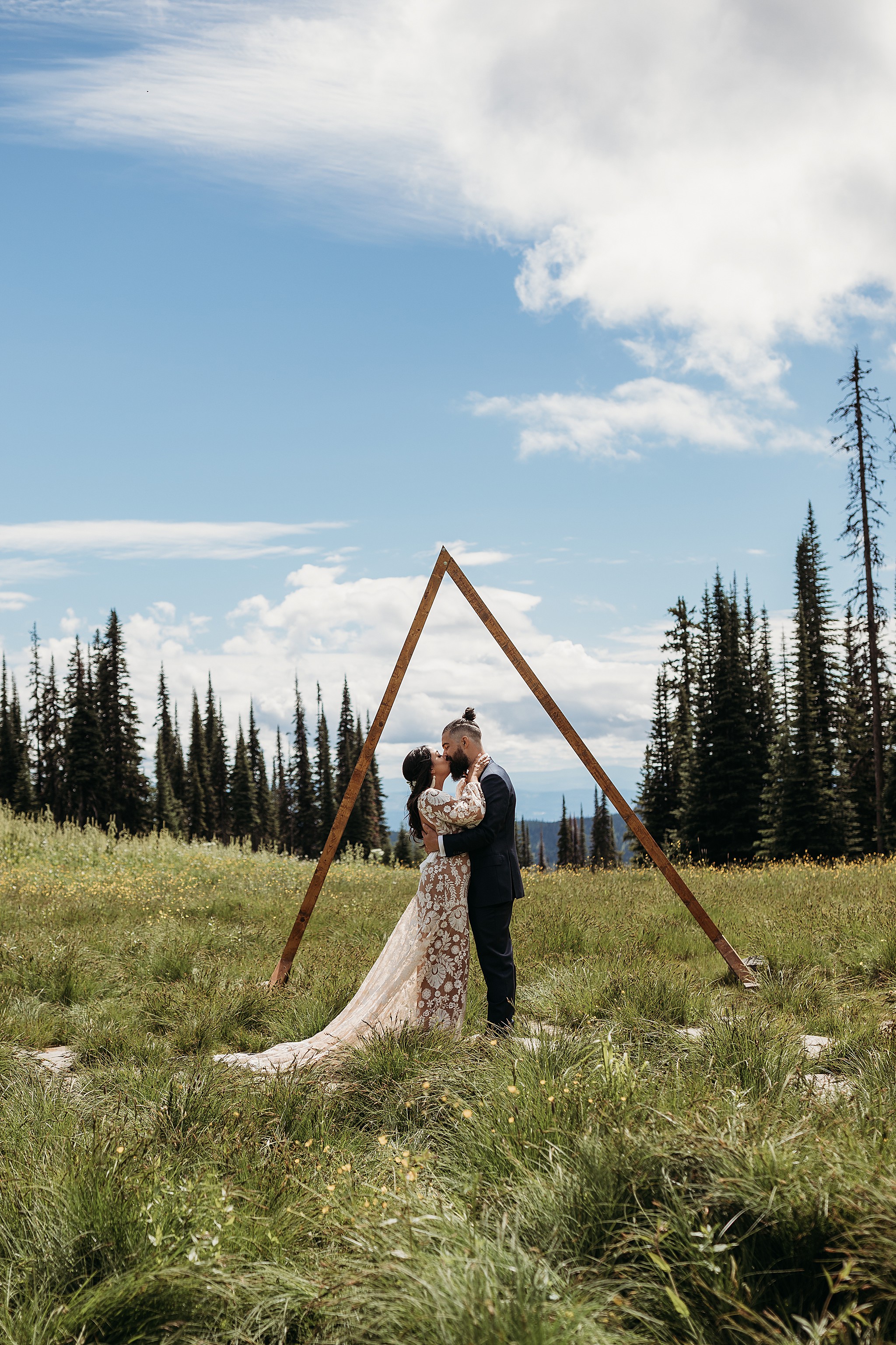 first kiss as bride and groom at their mountain elopement