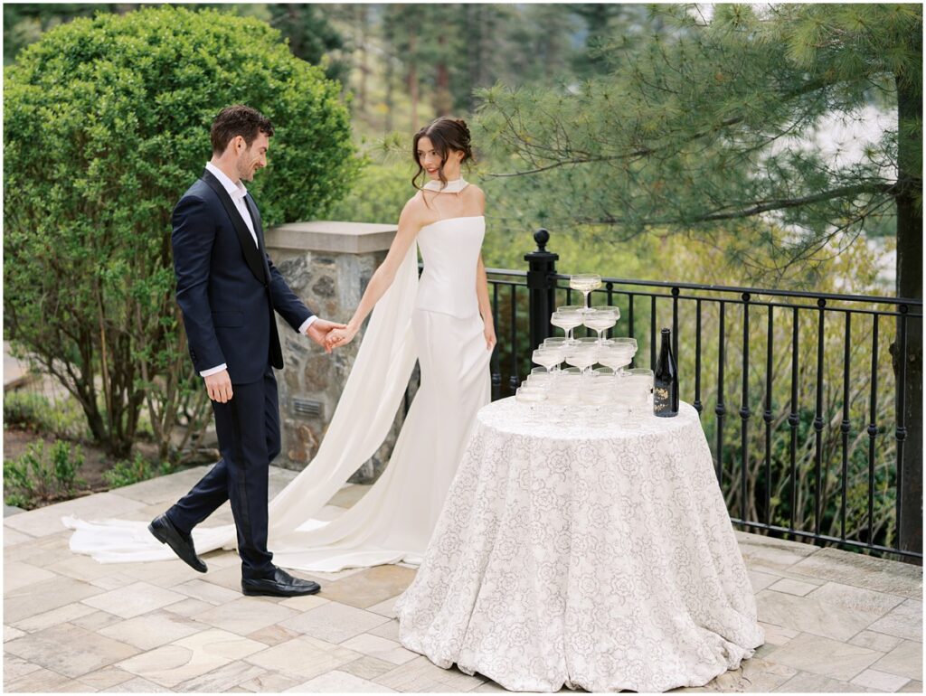 A bride and groom pose for photos for a European inspired wedding editorial at Chateau Okanagan.