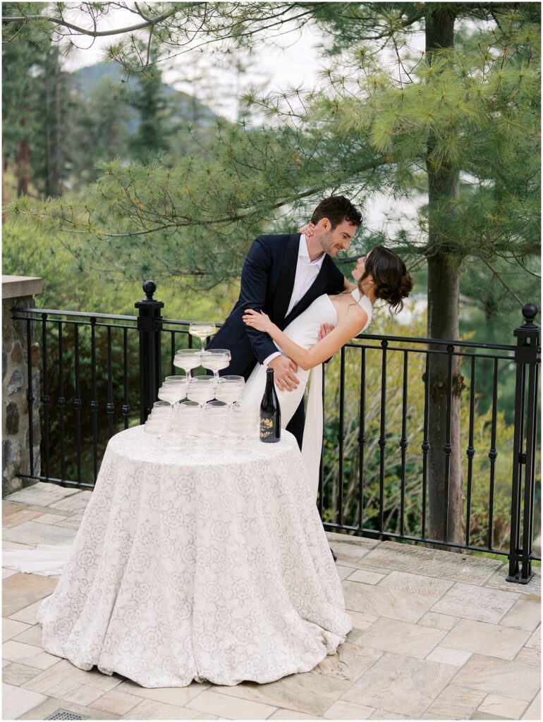 A bride and groom pose for photos for a European inspired wedding editorial at Chateau Okanagan.