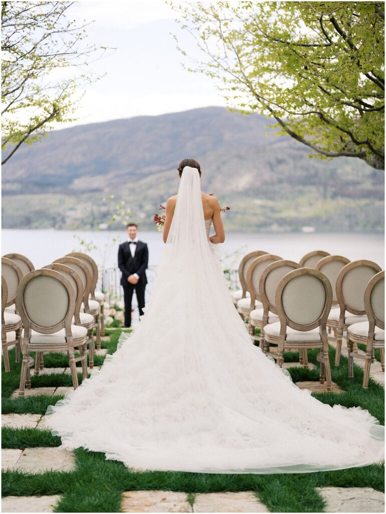 A bride walks towards her groom down the aisle