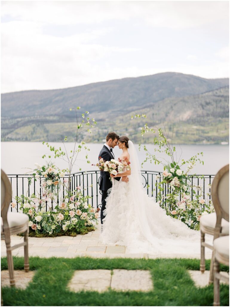 A bride and groom embrace each other at Chateau Okanagan
