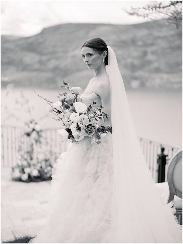 A bride holds a beautiful bouquet of flowers for a European Inspired wedding editorial at Chateau Okanagan.