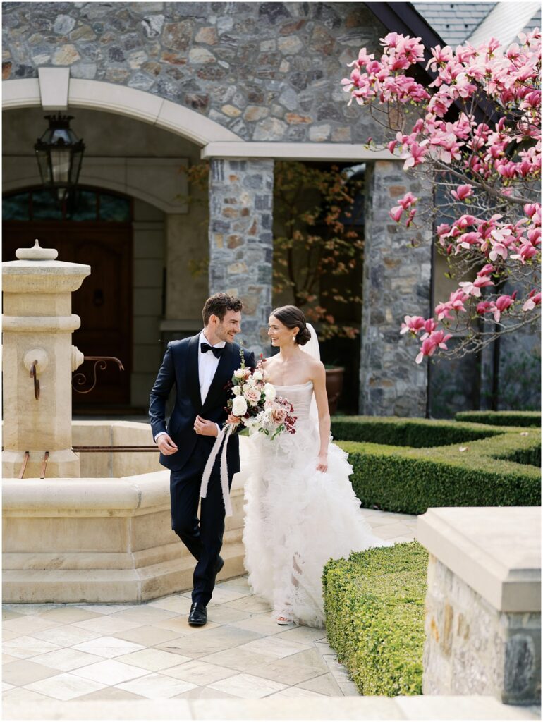 A bride and groom pose for photos for a European inspired wedding editorial at Chateau Okanagan.